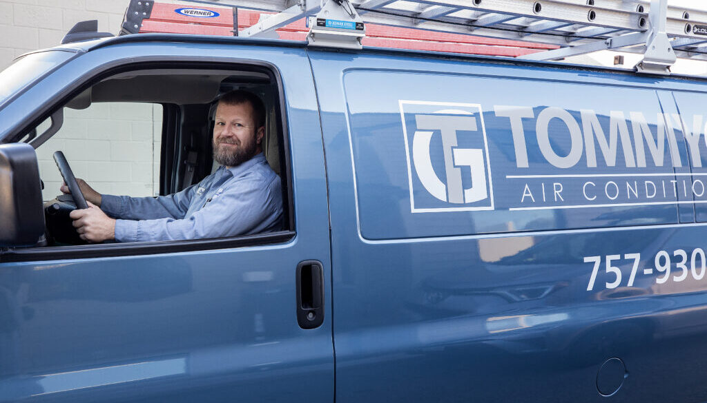 Tommy Garner Air Conditioning and Heating Van with smiling team member