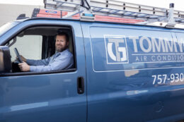 Tommy Garner Air Conditioning and Heating Van with smiling team member