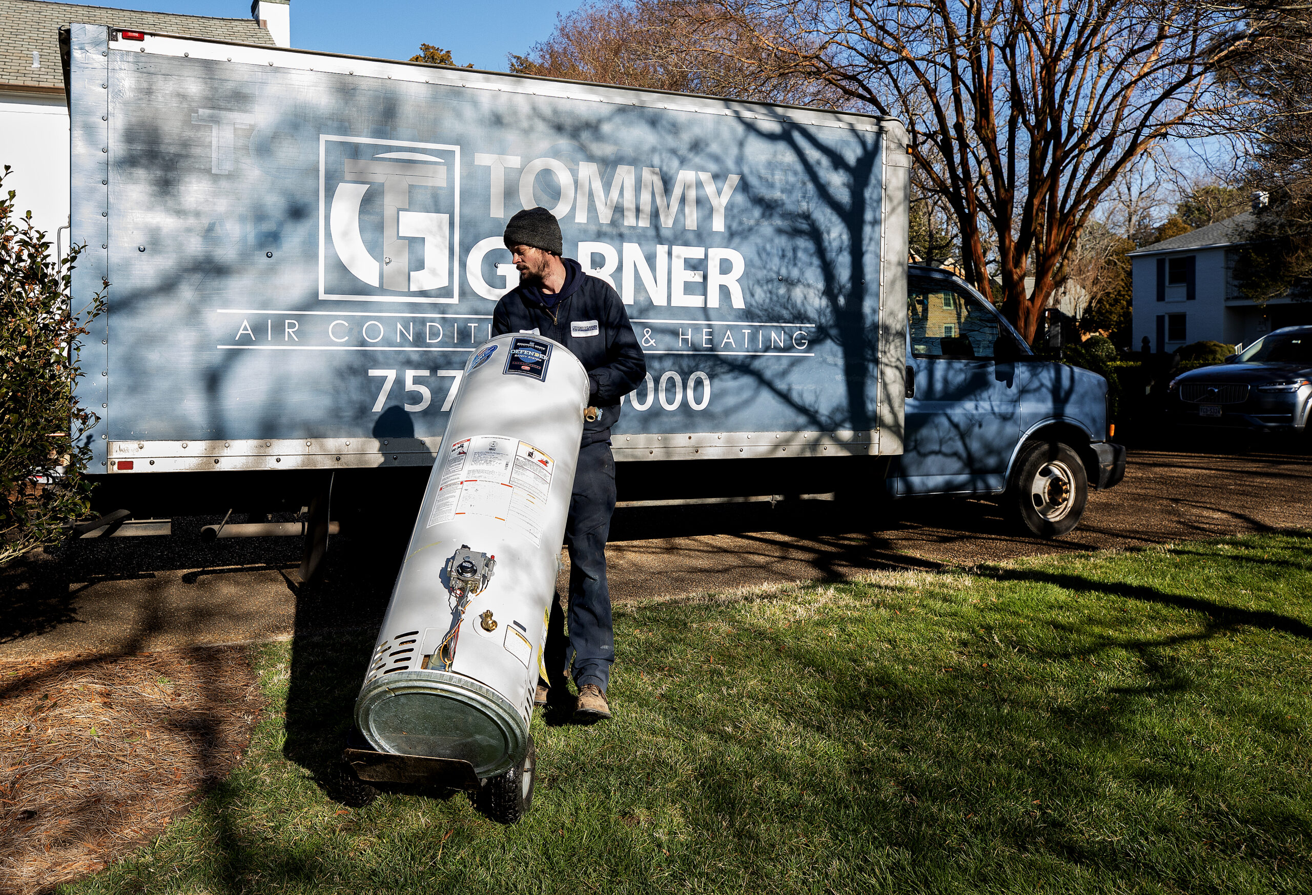 Water heater tank installation - gas, oil-fired, or electric.