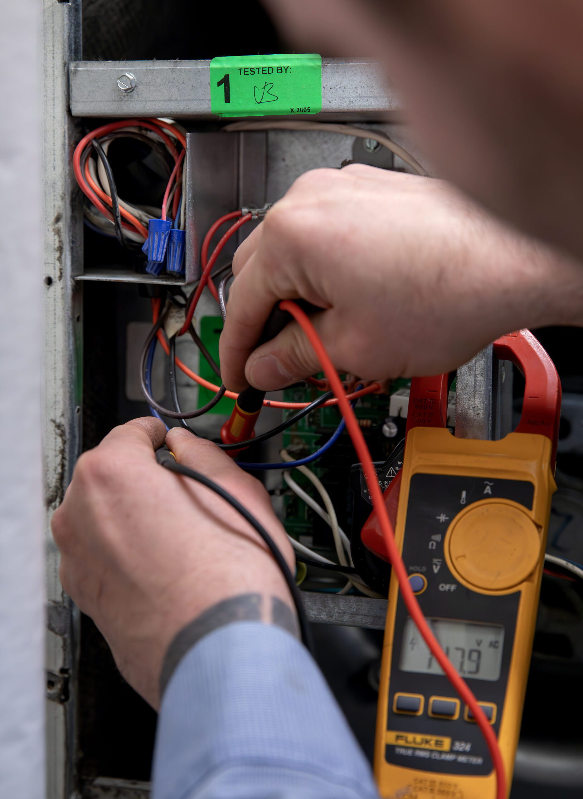 HVAC technician close up of hands working